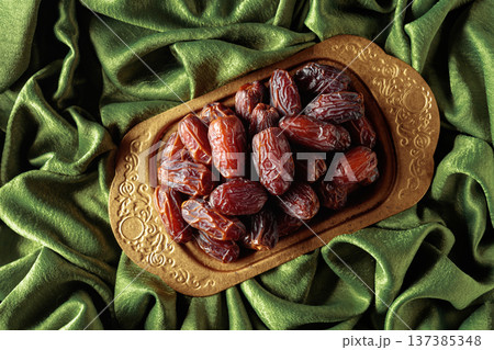 Dates on a golden platter. Dates on a golden platter. 137385348