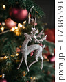 Christmas decoration on the Christmas tree. Festive background. New Year. Deer. 137385593