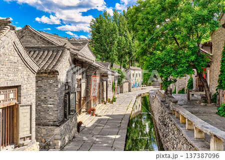 The ancient water town of Gubei near the site of the Great Wall of Simatai on a clear summer day. 137387096