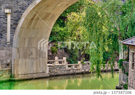 The ancient water town of Gubei near the site of the Great Wall of Simatai on a clear summer day. 137387106