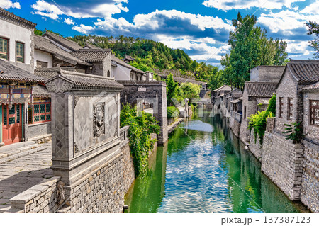 The ancient water town of Gubei near the site of the Great Wall of Simatai on a clear summer day. The ancient water town of Gubei near the site of the Great Wall of Simatai on a clear summer day. 137387123