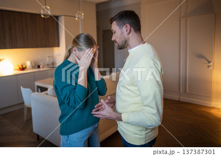 Married couple in relationships crisis, cheating husband explains about love affair for shocked wife Married couple in relationships crisis, cheating husband explains about love affair for shocked wife 137387301