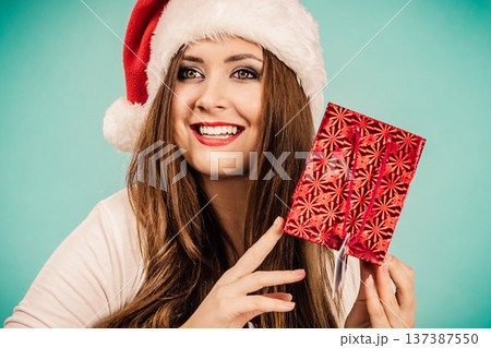 Happy Christmas woman holds red gift bag 137387550