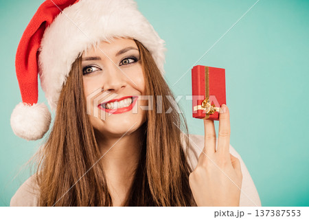 Woman holds gift box. Christmas time Woman holds gift box. Christmas time 137387553