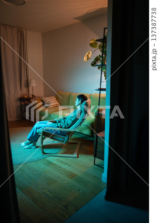 Tired tranquil senior woman sleeping in chair in room, life problems taking away energy and strength Tired tranquil senior woman sleeping in chair in room, life problems taking away energy and strength 137387738