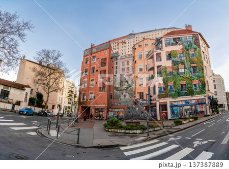 Lyon, france. December 27, 2023. Fresque des canuts, a large trompe l'oeil mural, transforming a building facade with an optical illusion of buildings and people Lyon, france. December 27, 2023. Fresque des canuts, a large trompe l'oeil mural, transforming a building facade with an optical illusion of buildings and people 137387889