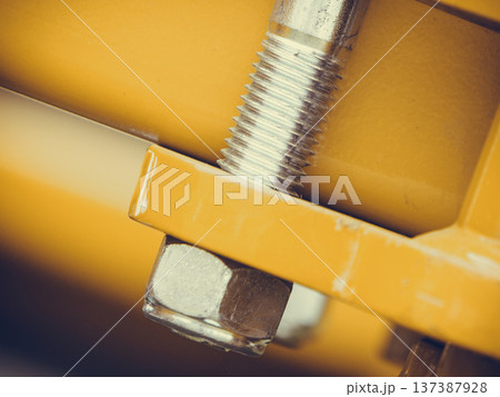 Screws on steel big machinery closeup Screws on steel big machinery closeup 137387928