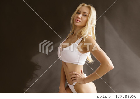 Beautiful blonde woman with smooth skin and toned body in white lingerie, beauty skin care and body care concep 137388956