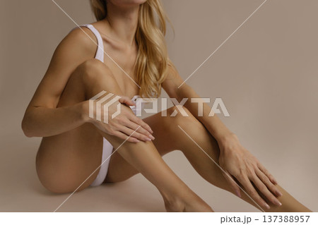 Smooth female legs and attractive body after hair removal, beauty skin care and epilation concept in studio light 137388957