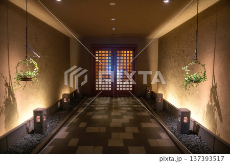 Hotel gate with hanging tree on basket at night, Kurokawa onsen 137393517