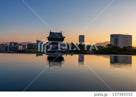 Kokura Castle with skyline reflection on water at dusk, Kitakyushu 137393553