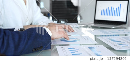 Business executive hands on contract paper with pen, preparing to sign an agreement during a meeting, representing corporate deal negotiation and legal process Business executive hands on contract paper with pen, preparing to sign an agreement during a meeting, representing corporate deal negotiation and legal process 137394203