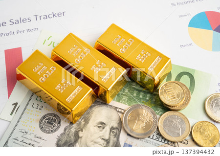 Gold bars with US dollar and Euro banknote money, finance trading investment business currency. Gold bars with US dollar and Euro banknote money, finance trading investment business currency. 137394432