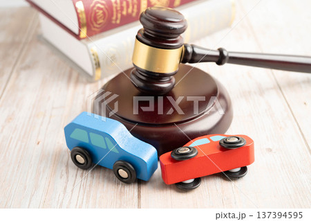 Car accident lawsuit and insurance, Judge hammer with car model. 137394595