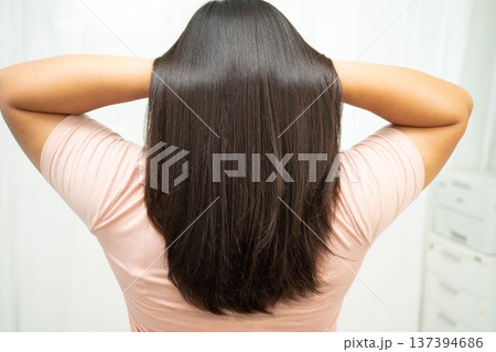 Woman with beautiful shine hair care treatment. Woman with beautiful shine hair care treatment. 137394686
