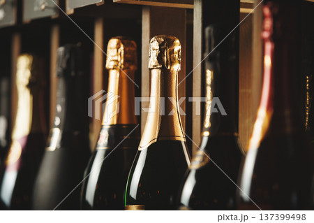 Underground cellar with elite sparkling wine on shelves, close up horizontal photo. 137399498
