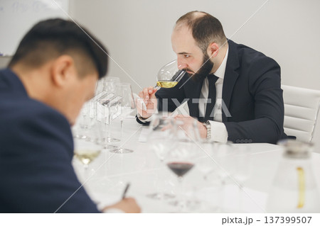 Sommelier degustate wine. Blind wine tasting. Training of restaurant staff, studying alcohol list.  137399507