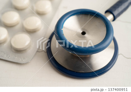 Stethoscope on electrocardiogram ECG with drug, heart wave, heart attack, cardiogram report. Stethoscope on electrocardiogram ECG with drug, heart wave, heart attack, cardiogram report. 137400951
