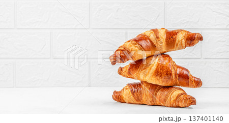 Stack of Fresh Croissants on Light Background Stack of Fresh Croissants on Light Background 137401140