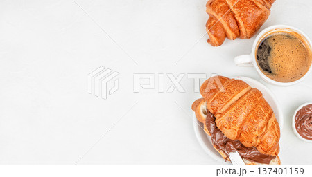 Croissant with Chocolate Spread and Coffee Breakfast Top View Croissant with Chocolate Spread and Coffee Breakfast Top View 137401159