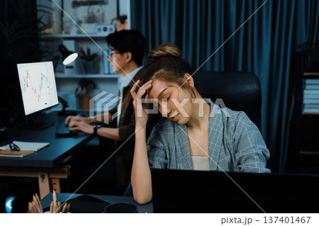 Businesswoman working with stretching while coworker investing stock. Infobahn. Businesswoman working with stretching while coworker investing stock. Infobahn. 137401467