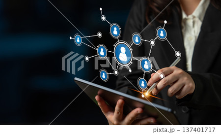 Business Professional Engaging with Digital Network Connections through Tablet Touchscreen Technology in a Modern Office Setting. Tessel Business Professional Engaging with Digital Network Connections through Tablet Touchscreen Technology in a Modern Office Setting. Tessel 137401717