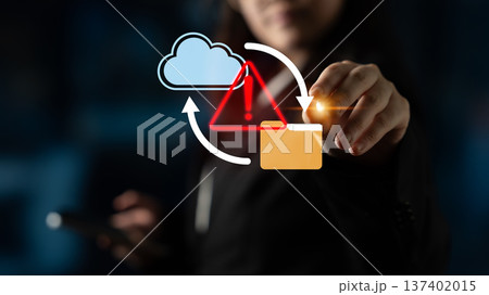 Business professional interacting with cloud technology symbols, including warning sign and folder icon representing data security and management risks Gantry Business professional interacting with cloud technology symbols, including warning sign and folder icon representing data security and management risks Gantry 137402015