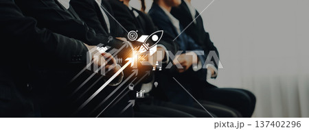 Business professionals in suits sitting in a row, with a rocket graphic symbolizing growth, innovation, and success for corporate strategies and projects. Trope 137402296