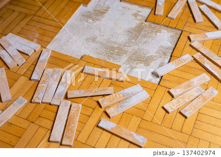 Preparing Old Parquet Flooring for Professional Restoration 137402974