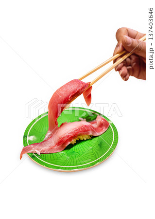 Top view of Fresh Tuna fish or Otoro with chopsticks in the red plate, focus selective Top view of Fresh Tuna fish or Otoro with chopsticks in the red plate, focus selective 137403646