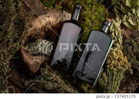 Vintage bottles with tinctures and various dried herbs. Vintage bottles with tinctures and various dried herbs. 137405170