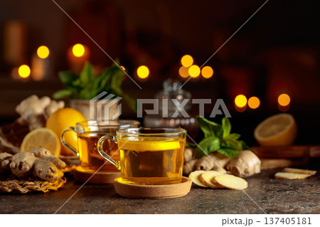 Cup of ginger tea with lemon, honey, mint, and ginger root. Cup of ginger tea with lemon, honey, mint, and ginger root. 137405181