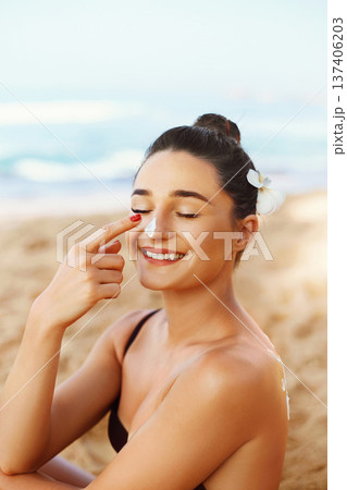 Suncream. Suntan Lotion Beautiful Woman Applying on beautifu on Face. Sunscreen Solar Cream. Skin care. Sun protection.The Girl Uses Moisturizer Sunblock Suncream. Suntan Lotion Beautiful Woman Applying on beautifu on Face. Sunscreen Solar Cream. Skin care. Sun protection.The Girl Uses Moisturizer Sunblock 137406203