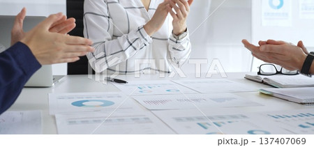 Business handshake agreement in modern office with financial documents, successful partnership deal, teamwork collaboration and corporate negotiation concept 137407069