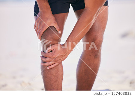 Hands, knee pain and athlete at beach, accident and fitness exercise in sport workout outdoor. Legs, injury and arthritis of man, muscle problem and fibromyalgia in medical emergency for osteoporosis 137408832