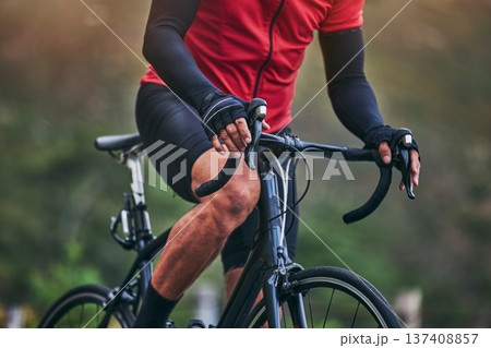 Sports, cycling and hands with person on bike in nature for fitness, training or challenge. Exercise, workout and health with closeup of man on bicycle in mountains for energy, freedom or performance Sports, cycling and hands with person on bike in nature for fitness, training or challenge. Exercise, workout and health with closeup of man on bicycle in mountains for energy, freedom or performance 137408857