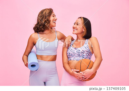 Sports, fitness and women on pink background for yoga, training and exercise with ball and yogi mat. Friends, happy and people in studio with gym equipment for wellness, workout and healthy body Sports, fitness and women on pink background for yoga, training and exercise with ball and yogi mat. Friends, happy and people in studio with gym equipment for wellness, workout and healthy body 137409105