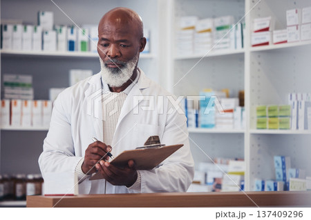 Pharmacy, clipboard and mature black man writing notes of product description, medical drugs information or clinic stock take. List, pills and African pharmacist doing store inventory of supplements 137409296