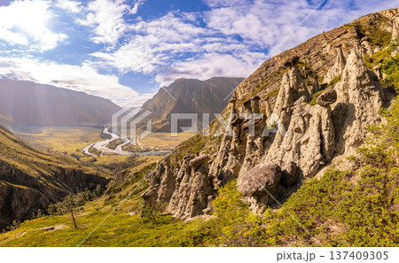 Aerial panaramic view to Natural formations stone mushrooms in Akkurum tract against blue sky, rock formations of a bizarre shape in sunny day. Ulagan Chulyshman river Valley, Altai Republic, Russia 137409305