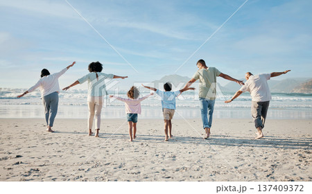 Playing, together and big family on beach, vacation or holiday freedom in summer with children and generations flying. Parents, grandparents and kids play game to fly, airplane for fun and happiness Playing, together and big family on beach, vacation or holiday freedom in summer with children and generations flying. Parents, grandparents and kids play game to fly, airplane for fun and happiness 137409372