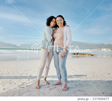 Hug, portrait and woman with mother at a beach happy, bond and relax in nature together. Love, smile and lady face with mom the ocean for freedom, travel and adventure trip at the sea in South Africa 137409477