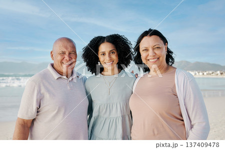 Portrait of senior parents with woman on beach, smile and embrace on tropical summer holiday in Australia. Ocean, vacation sun and happy family with blue sky, water and love, island travel together. 137409478