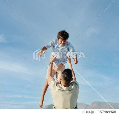 Dad, son and blue sky, playing together in summer and tropical island holiday on beach in Hawaii. Fun, father and and son on ocean vacation with airplane games to relax, trust and support in nature. 137409486