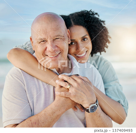 Beach, portrait and woman with her senior dad on family vacation, holiday or adventure. Happy, smile and young female person hugging her elderly father with love and care by the ocean on weekend trip Beach, portrait and woman with her senior dad on family vacation, holiday or adventure. Happy, smile and young female person hugging her elderly father with love and care by the ocean on weekend trip 137409493
