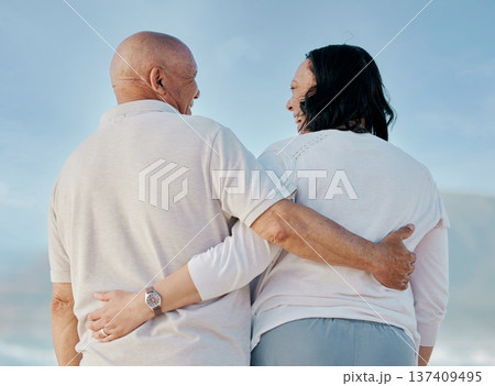 Back, love and hug with old couple at beach for travel, support and summer vacation. Relax, bonding and retirement with senior man and woman on seaside holiday for trust, health and marriage together 137409495