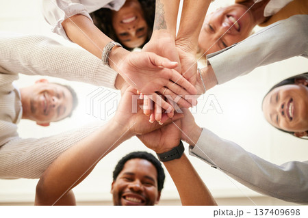 Office, team building and hands together from below in huddle for teamwork, collaboration and motivation at startup. Work, goals and diversity, group of people with business growth and staff support. Office, team building and hands together from below in huddle for teamwork, collaboration and motivation at startup. Work, goals and diversity, group of people with business growth and staff support. 137409698