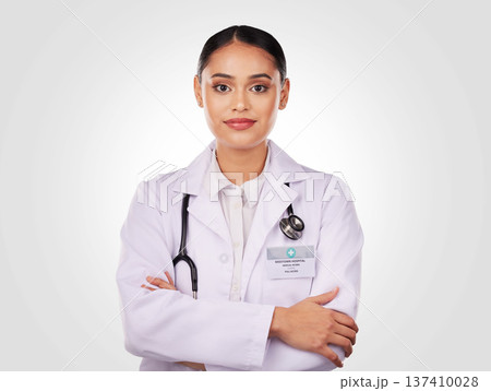 Doctor, proud and portrait of woman with arms crossed, confidence and expert in medicine and healthcare on white background. Medical worker, person and professional in studio with stethoscope Doctor, proud and portrait of woman with arms crossed, confidence and expert in medicine and healthcare on white background. Medical worker, person and professional in studio with stethoscope 137410028