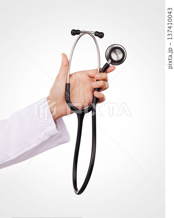 Stethoscope in hand, doctor and health, cardiology and wellness with equipment isolated on white background. Cardiovascular healthcare, listen to heart beat and person in studio with medical tools Stethoscope in hand, doctor and health, cardiology and wellness with equipment isolated on white background. Cardiovascular healthcare, listen to heart beat and person in studio with medical tools 137410043