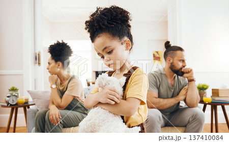 Divorce, custody and sad boy child with teddy bear in living room for stress, support and comfort at home. Family, crisis and kid with anxiety for toxic parents, argue or dispute, depression or fear 137410084