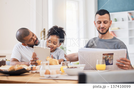 Gay parents, morning and breakfast with child in a home with reading and tablet with dad. Food, house and family with bonding, care and love together at dining table with paper and tech with kid 137410099